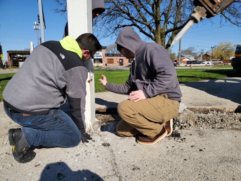 Electricians discussing a job.