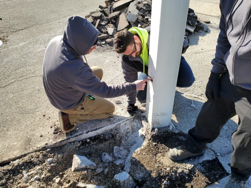 Electricians discussing a job.