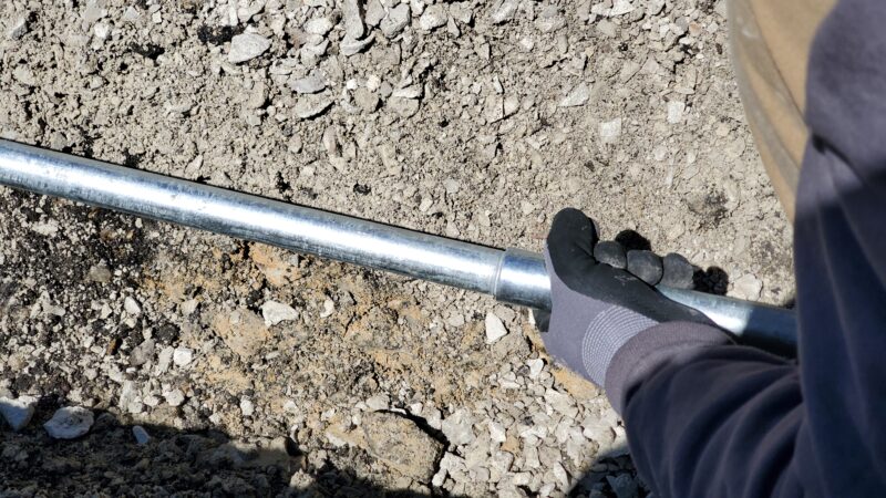 Electrical conduit pipes being connected.