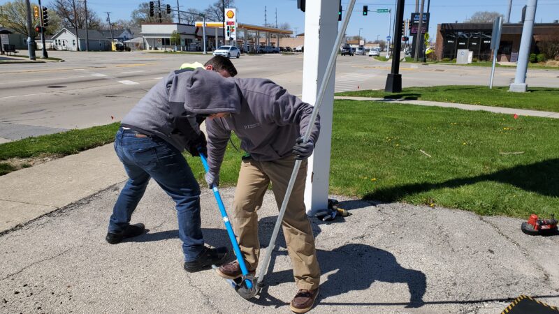 Electricians bending conduit pipe.