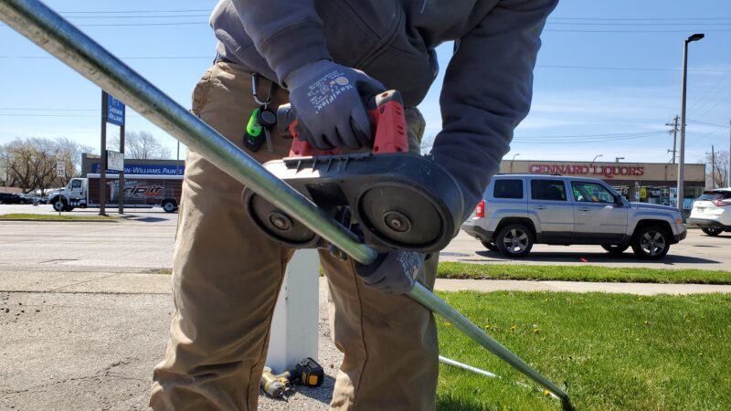 Electrical conduit pipes being cut.