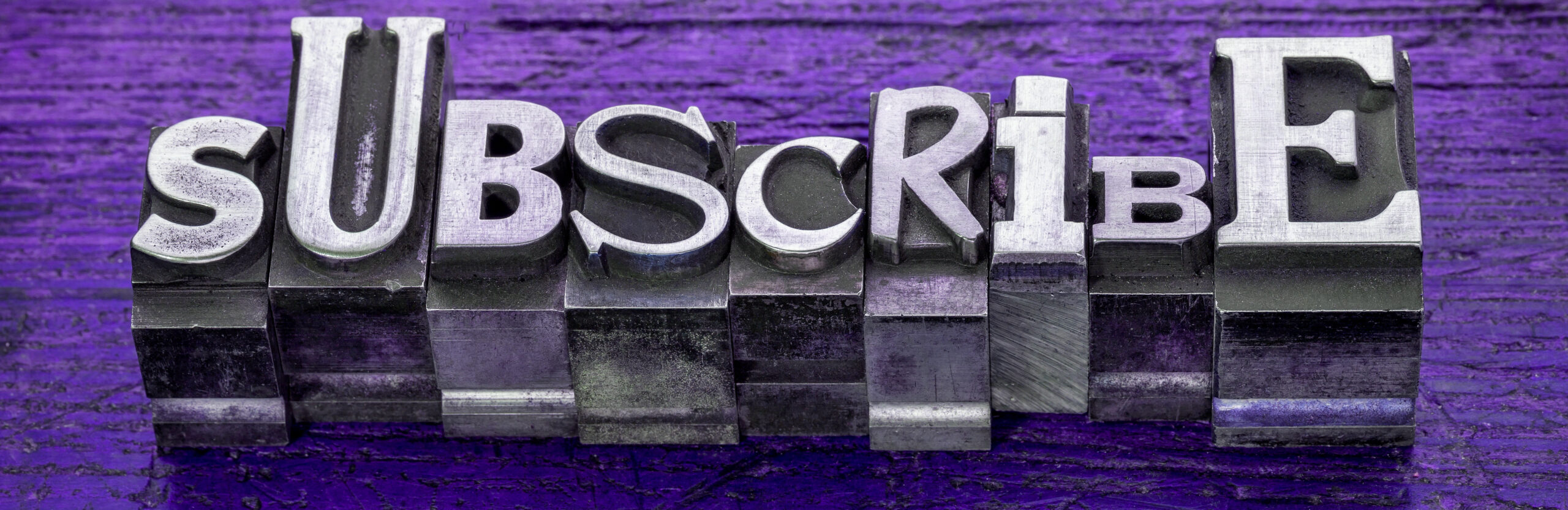 subscribe word  in metal type